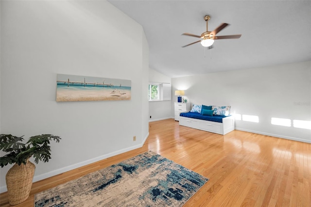833 Lakeside Ter, Palm Harbor, FL 34683 - bedroom with baseboards, ceiling fan, vaulted ceiling, and wood finished floors