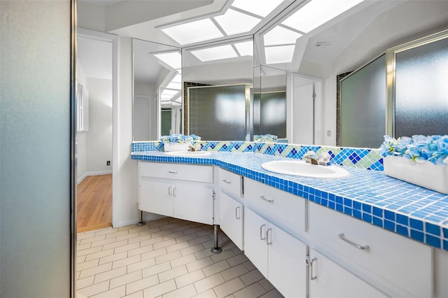 833 Lakeside Ter, Palm Harbor, FL 34683 - full bathroom with a sink, tile patterned flooring, and double vanity