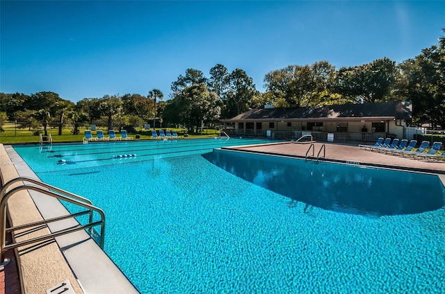 833 Lakeside Ter, Palm Harbor, FL 34683 - community pool with a patio and fence