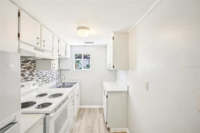 kitchen featuring a sink, white appliances, under cabinet range hood, light countertops, and tasteful backsplash