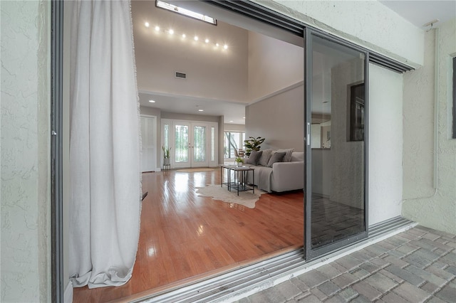 property entrance with visible vents and french doors