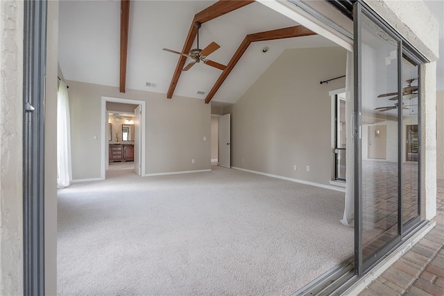 unfurnished living room featuring carpet floors, a ceiling fan, baseboards, and visible vents