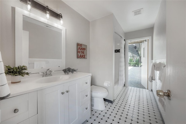 full bath featuring tile patterned flooring, vanity, toilet, a shower, and visible vents