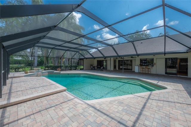 pool with ceiling fan, a patio area, a lanai, and a jacuzzi