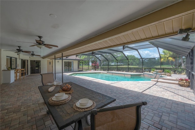 pool featuring a ceiling fan, a patio area, and a lanai