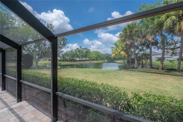 unfurnished sunroom with a water view