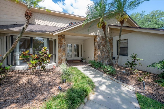 view of front of property featuring french doors and stone siding