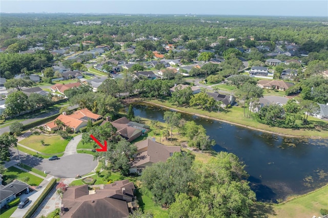drone / aerial view with a water view and a residential view
