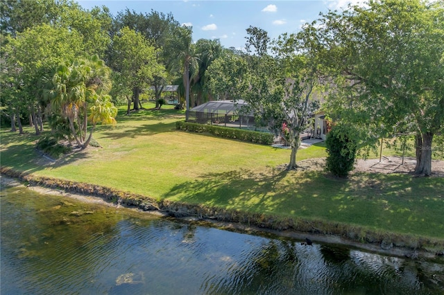 surrounding community with a lawn and a water view