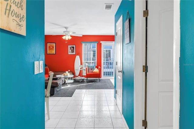 250 Medallion Blvd Unit H, Madeira Beach, FL 33708 - hallway featuring light tile patterned floors and visible vents