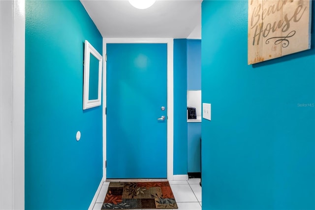 250 Medallion Blvd Unit H, Madeira Beach, FL 33708 - entryway featuring tile patterned floors and baseboards