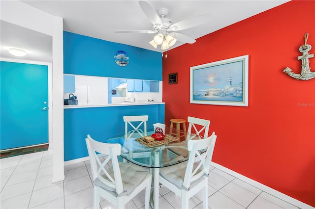 250 Medallion Blvd Unit H, Madeira Beach, FL 33708 - dining room with tile patterned floors, baseboards, and a ceiling fan