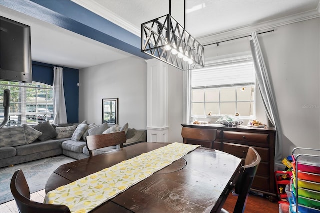 dining space featuring dark wood-type flooring and ornamental molding