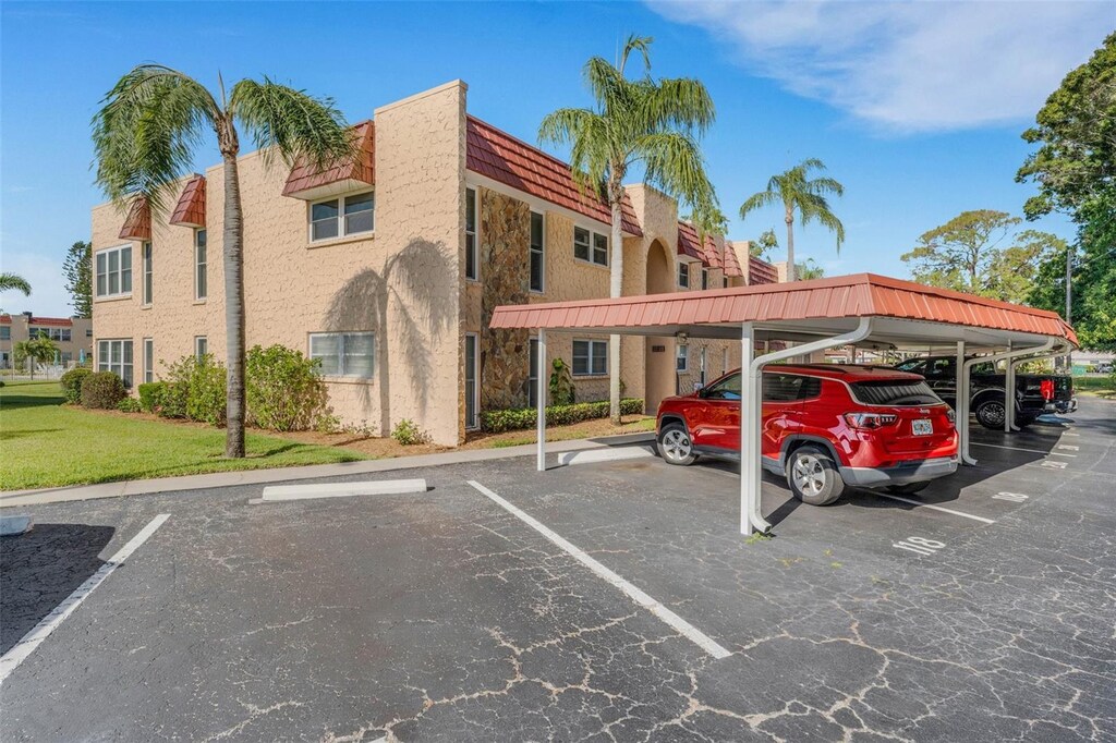 120 Cedarwood Cir Unit 120, Seminole, FL 33777 - view of partially covered parking lot
