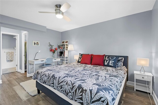 bedroom featuring a ceiling fan, baseboards, and wood finished floors
