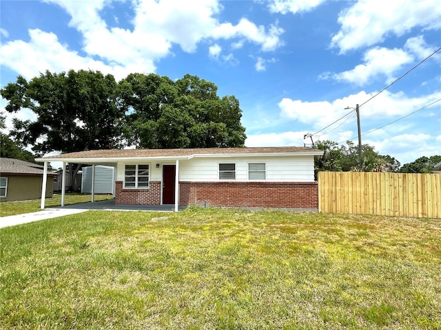 8310 Croton Ave, Tampa, FL 33619 - ranch-style home featuring driveway, a front yard, brick siding, fence, and an attached carport