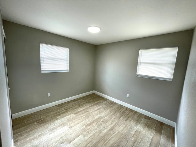 8310 Croton Ave, Tampa, FL 33619 - empty room featuring baseboards and wood finished floors
