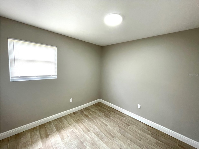 8310 Croton Ave, Tampa, FL 33619 - empty room featuring baseboards and wood finished floors