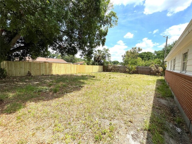 8310 Croton Ave, Tampa, FL 33619 - view of yard featuring a fenced backyard
