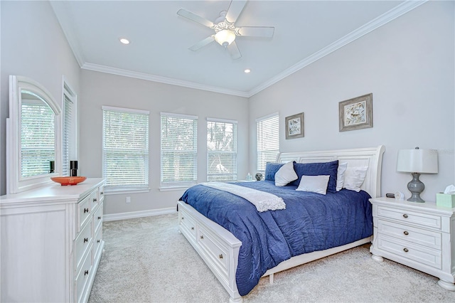 bedroom featuring light colored carpet, ornamental molding, baseboards, and a ceiling fan