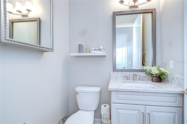 half bath with vanity and toilet