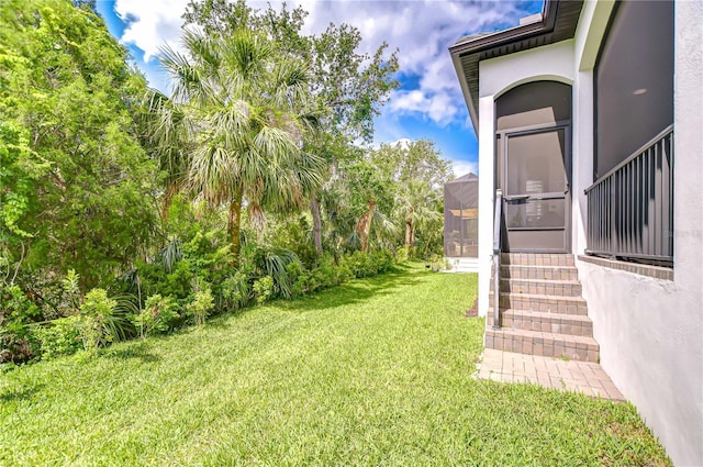 view of yard featuring entry steps