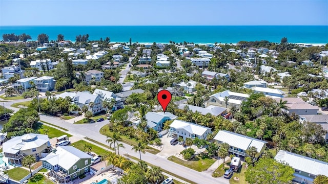 aerial view featuring a water view and a residential view