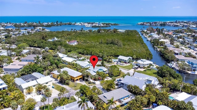 drone / aerial view featuring a residential view and a water view