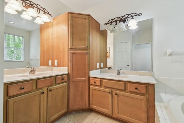 bathroom with tile patterned floors, two vanities, and a sink