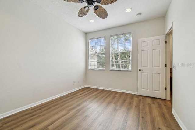 unfurnished room featuring baseboards, recessed lighting, ceiling fan, and wood finished floors