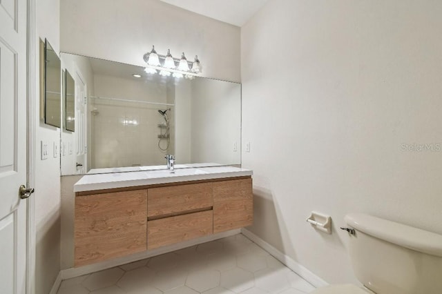 full bathroom with baseboards, tile patterned flooring, toilet, and tiled shower