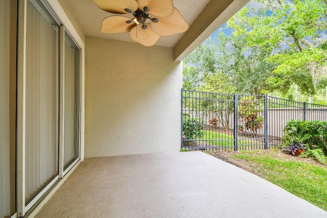 view of patio / terrace featuring fence and ceiling fan