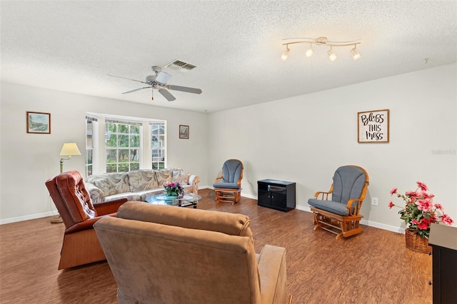 2373 Hounds Trl, Palm Harbor, FL 34683 - living area featuring visible vents, a textured ceiling, ceiling fan, and wood finished floors