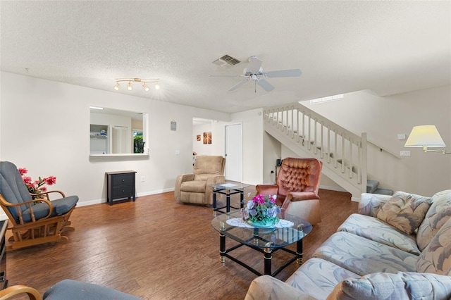 2373 Hounds Trl, Palm Harbor, FL 34683 - living area featuring visible vents, stairs, wood finished floors, baseboards, and ceiling fan