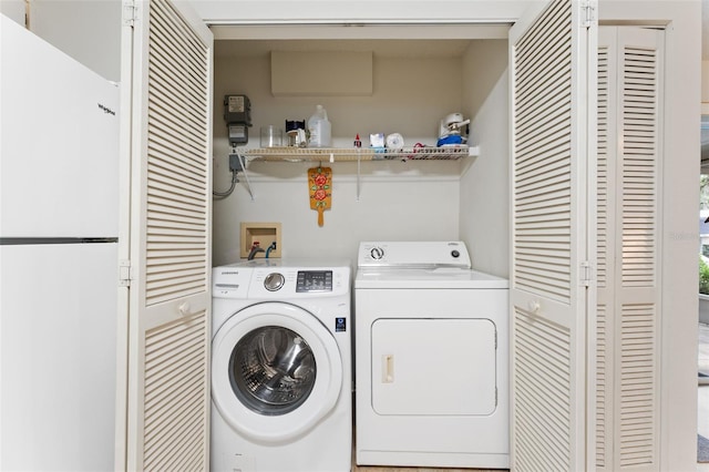 2373 Hounds Trl, Palm Harbor, FL 34683 - laundry room featuring laundry area and washing machine and dryer