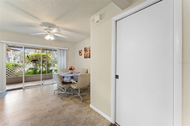 2373 Hounds Trl, Palm Harbor, FL 34683 - dining space with a textured ceiling and ceiling fan