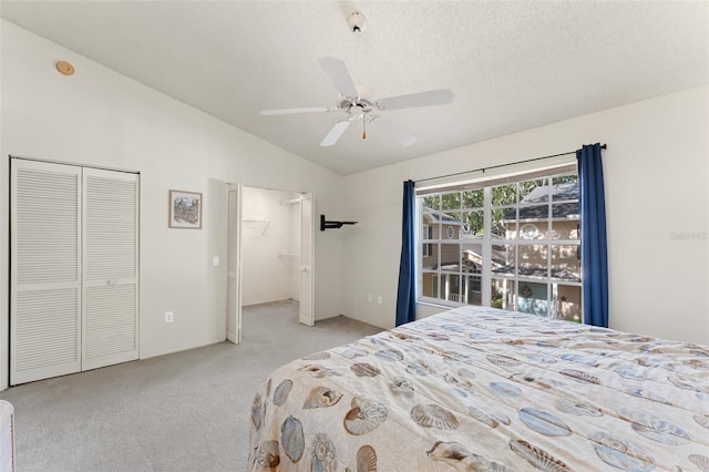 2373 Hounds Trl, Palm Harbor, FL 34683 - bedroom with a ceiling fan, a textured ceiling, light colored carpet, and lofted ceiling