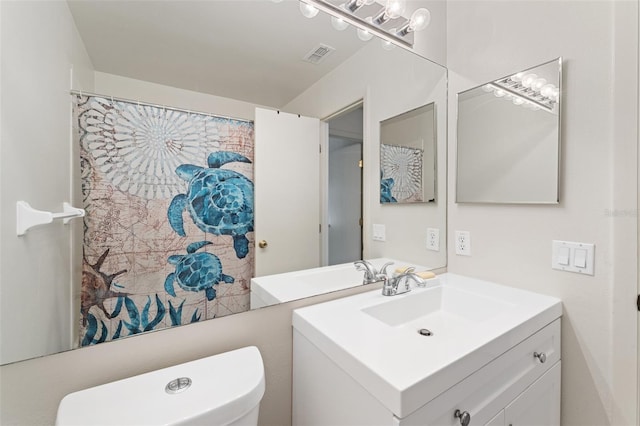 2373 Hounds Trl, Palm Harbor, FL 34683 - full bathroom with vanity, toilet, and visible vents