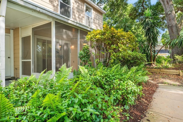 2373 Hounds Trl, Palm Harbor, FL 34683 - view of property exterior featuring a sunroom