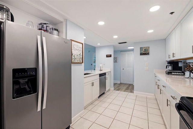 kitchen with white cabinets, appliances with stainless steel finishes, recessed lighting, baseboards, and visible vents