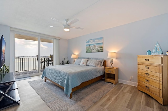bedroom featuring a ceiling fan, baseboards, access to exterior, and light wood-style flooring
