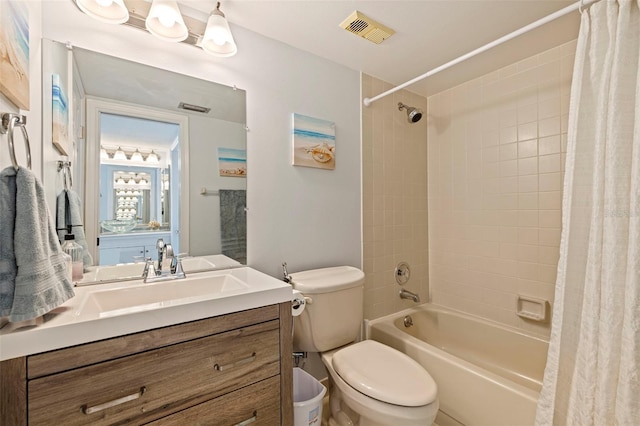 full bath featuring vanity, toilet, visible vents, and shower / tub combo