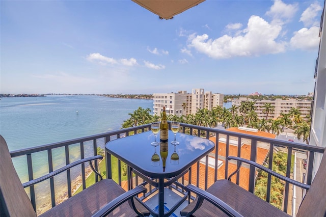 balcony featuring a water view