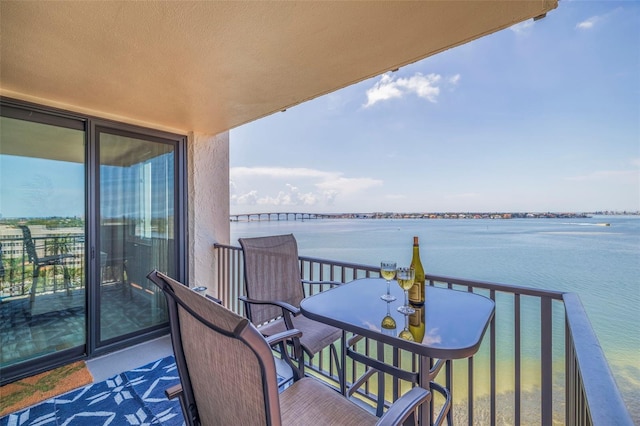 balcony featuring a water view