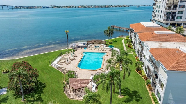 birds eye view of property with a water view