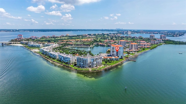birds eye view of property with a view of city and a water view