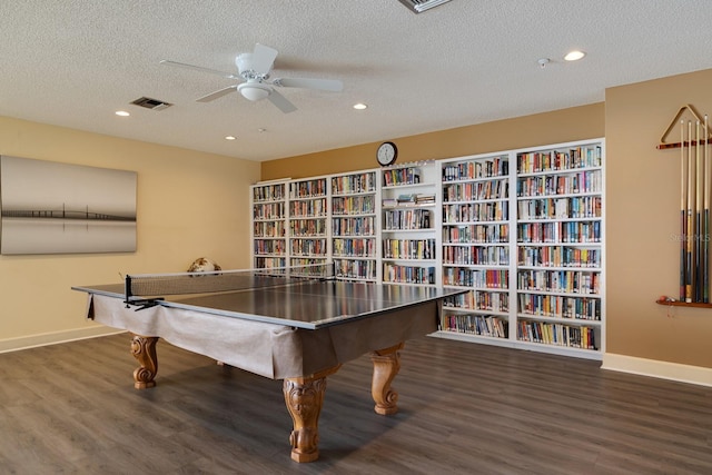 game room with a ceiling fan, baseboards, visible vents, and wood finished floors