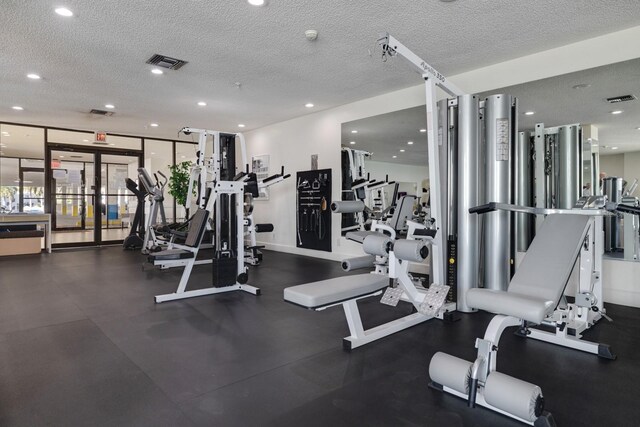6287 Bahia Del Mar Cir Unit 801, Saint Petersburg, FL 33715 - workout area with a textured ceiling, recessed lighting, and french doors