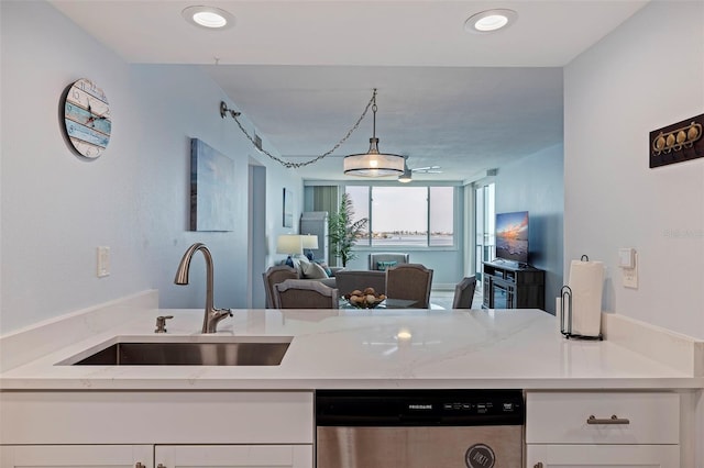 6287 Bahia Del Mar Cir Unit 801, Saint Petersburg, FL 33715 - kitchen with dishwasher, a sink, open floor plan, white cabinetry, and hanging light fixtures