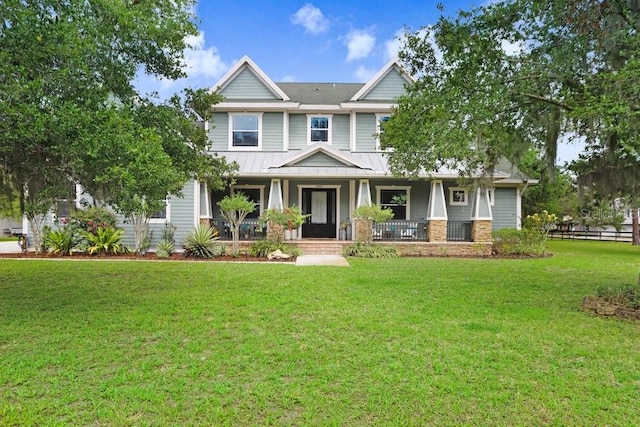 18929 Crescent Rd, Odessa, FL 33556 - craftsman-style house featuring a porch, a front yard, a standing seam roof, and metal roof